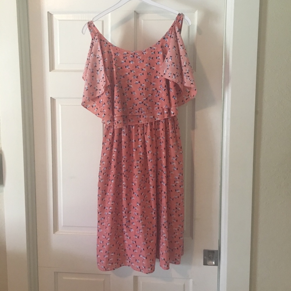 Kling pink sleeveless dress with fish print.